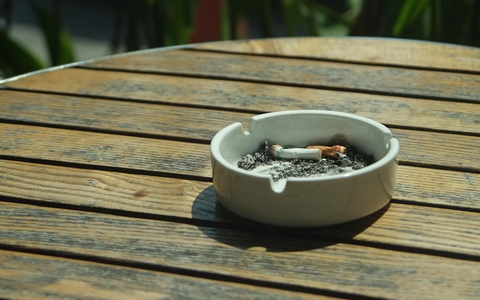 Cigarette, ashtray and smoke